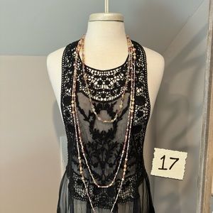 Long multi layered beaded necklace.
